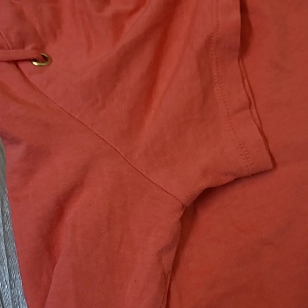Michael Kors Orange Short Sleeve Top with Lace-Up Detail used good condition‎